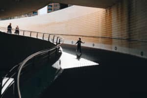 A family travel down an underpass